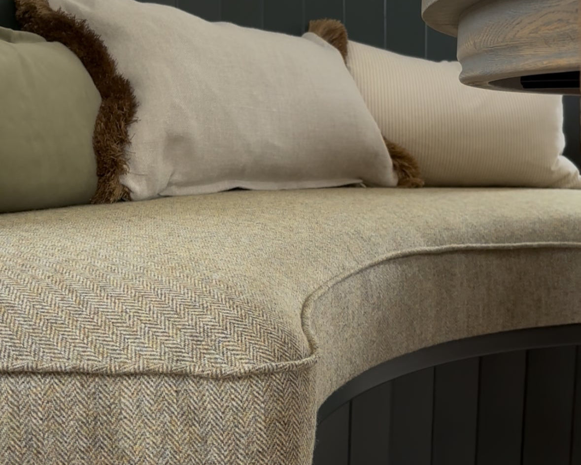 Close-up of a textured sofa with cushions in a room setting